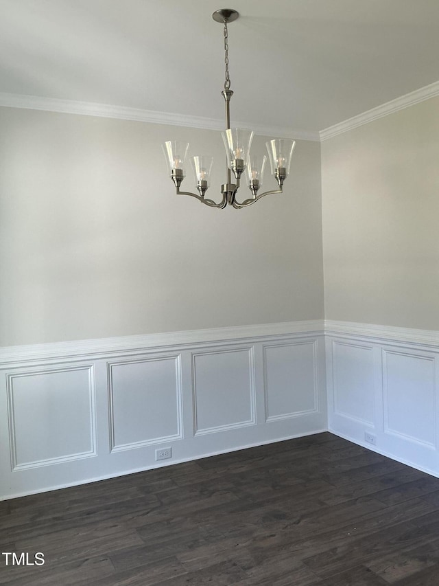 1039 N Lincoln St, Benson, NC 27504 - unfurnished dining area with a chandelier, ornamental molding, wainscoting, dark wood finished floors, and a decorative wall