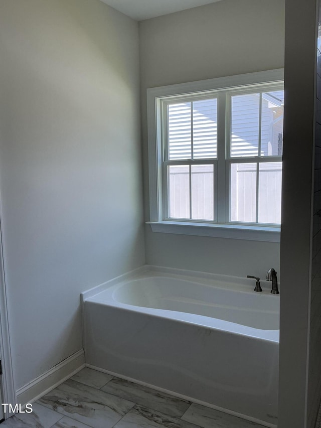 1039 N Lincoln St, Benson, NC 27504 - bathroom with healthy amount of natural light and a garden tub