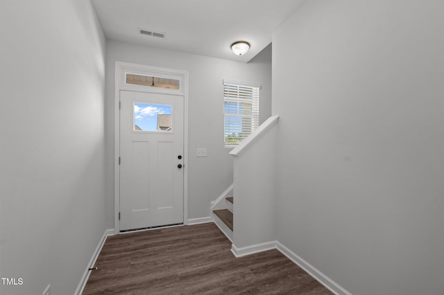1028 Gallivant Way, Wake Forest, NC 27587 - entryway featuring dark wood finished floors, baseboards, and stairs
