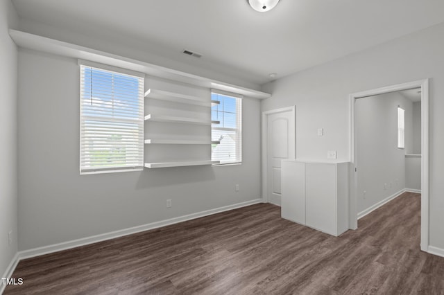 1028 Gallivant Way, Wake Forest, NC 27587 - unfurnished room featuring dark wood-type flooring and baseboards