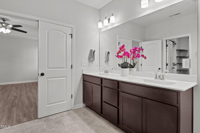 1028 Gallivant Way, Wake Forest, NC 27587 - full bath featuring ceiling fan, double vanity, baseboards, and tile patterned floors