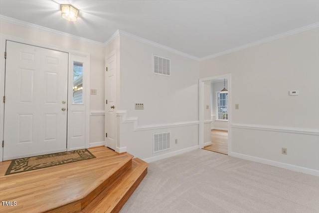 5 Wembley Ct, Durham, NC 27705 - entrance foyer featuring crown molding, plenty of natural light, and light carpet