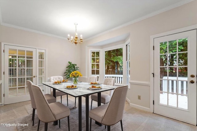 5 Wembley Ct, Durham, NC 27705 - dining space with a chandelier, ornamental molding, light colored carpet, and baseboards
