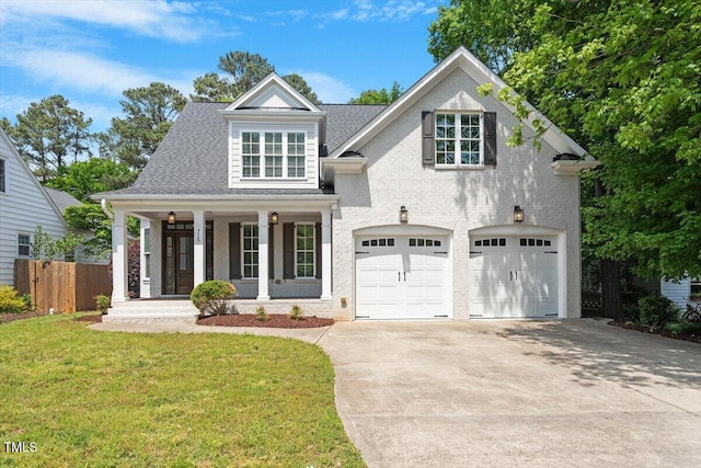 view of front of home with an attached garage, fence, a front yard, a porch, and driveway