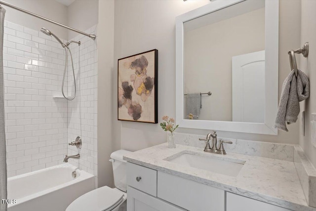 bathroom with vanity,  shower combination, and toilet