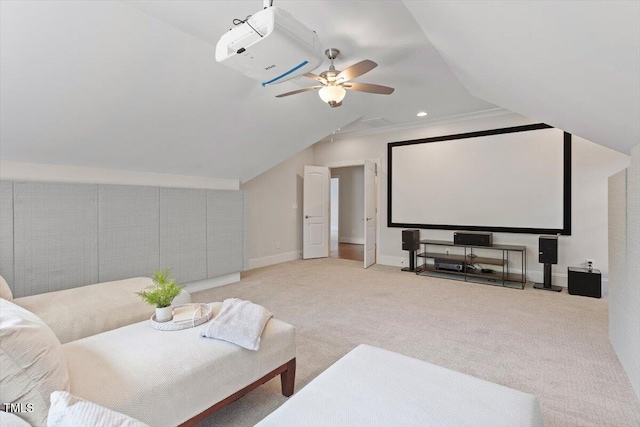 carpeted home theater featuring baseboards, ceiling fan, and lofted ceiling