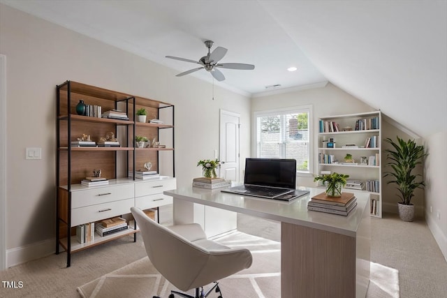 office area with light colored carpet, a ceiling fan, and baseboards