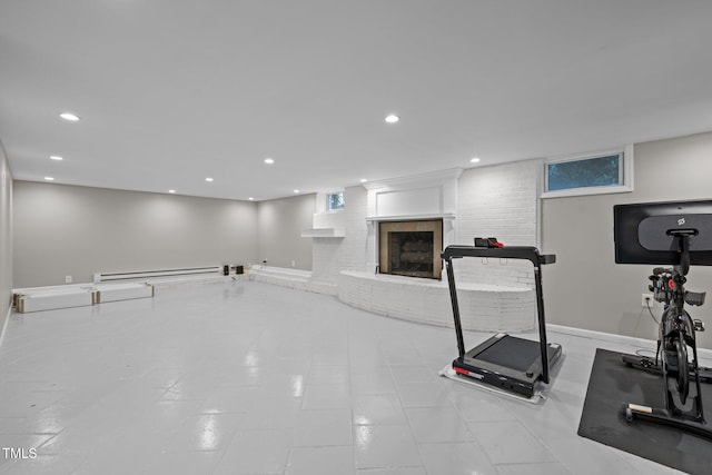 workout area featuring baseboards, a fireplace, a baseboard heating unit, and recessed lighting