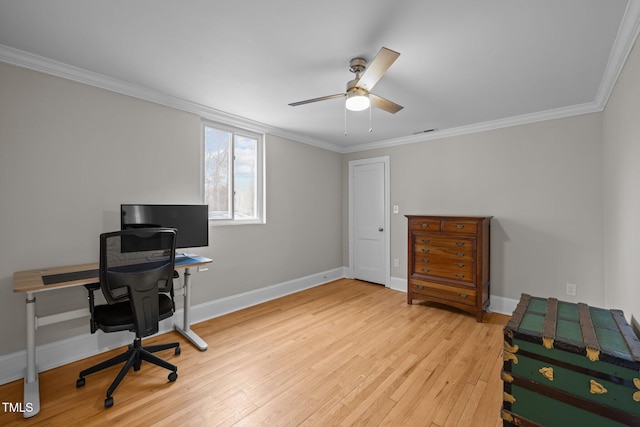 office with crown molding, a ceiling fan, baseboards, and light wood finished floors