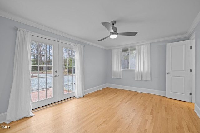 unfurnished room featuring baseboards, plenty of natural light, french doors, and light wood finished floors