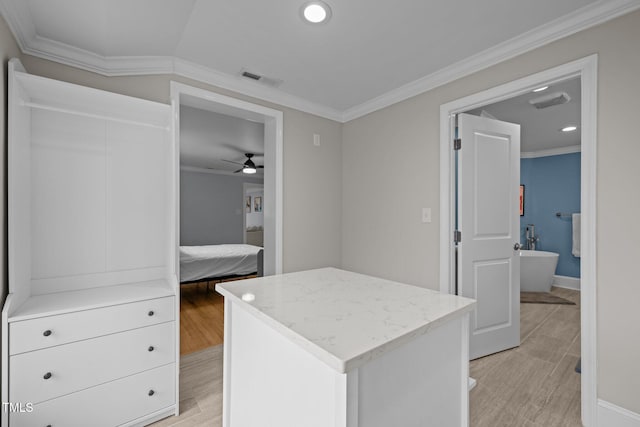 walk in closet featuring a ceiling fan, light wood-type flooring, and visible vents