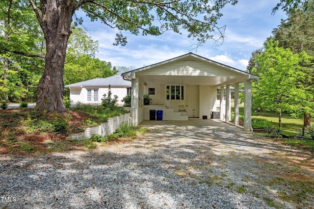 view of front of property featuring a carport
