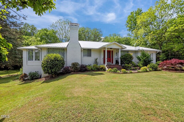 513 N Nash St, Hillsborough, NC 27278 - single story home featuring brick siding, a front lawn, and a chimney