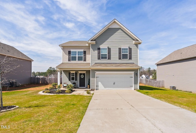 traditional-style house with a garage, driveway, a front yard, and fence