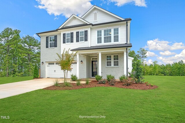 view of front of house with concrete driveway, a garage, a front lawn, and covered porch