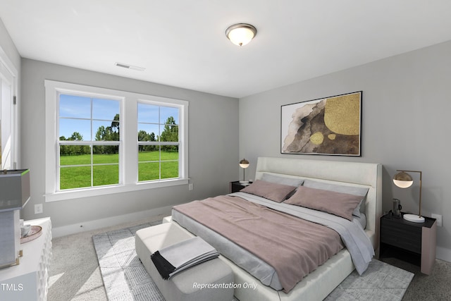 bedroom with carpet flooring and baseboards