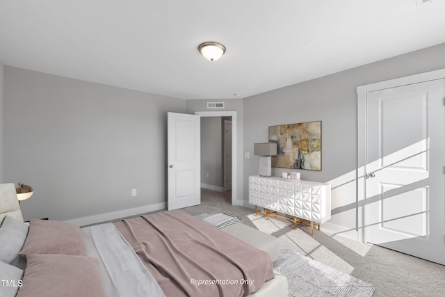 bedroom with carpet flooring and baseboards