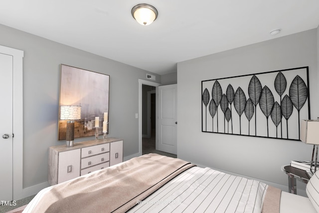 bedroom featuring baseboards