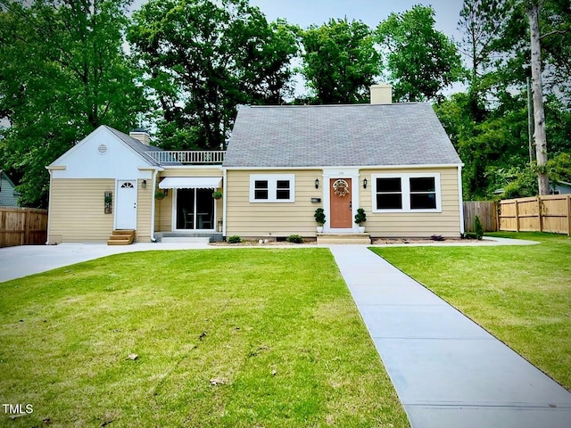 518 W Chisholm St, Sanford, NC 27330 - cape cod-style house with entry steps and a chimney