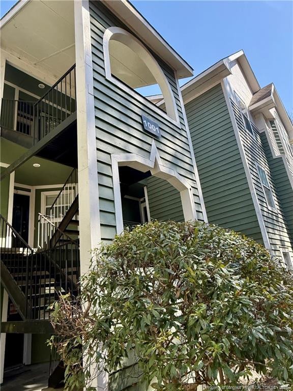 view of side of home with stairway