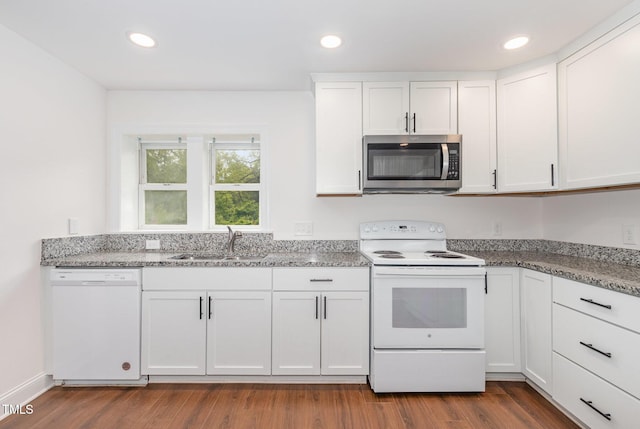 464 Longfellow St, Fuquay Varina, NC 27526 - kitchen featuring white appliances, a sink, dark wood-style flooring, white cabinetry, and recessed lighting