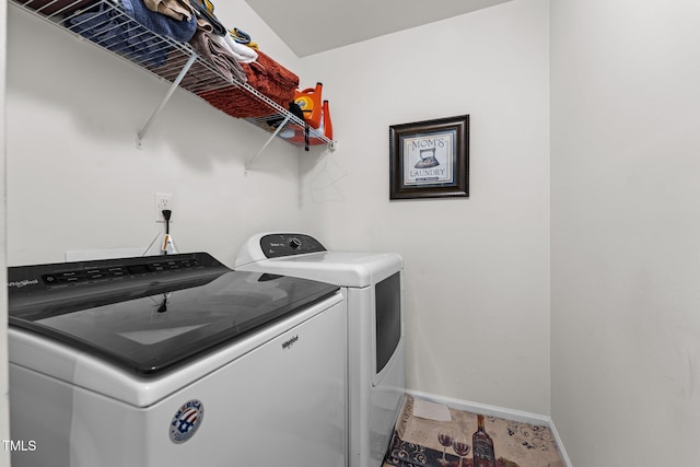 1055 Kerr St, Burlington, NC 27215 - laundry room with washer and dryer and baseboards