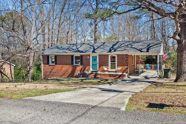 6407 Kimridge Rd, Fayetteville, NC 28314 - ranch-style house featuring brick siding, concrete driveway, and a carport