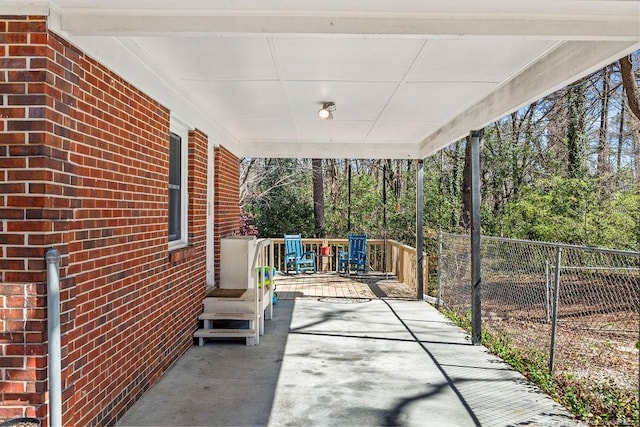 6407 Kimridge Rd, Fayetteville, NC 28314 - view of patio featuring an attached carport and fence