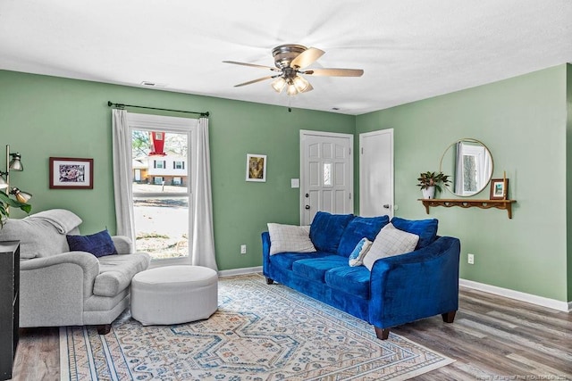 6407 Kimridge Rd, Fayetteville, NC 28314 - living area featuring wood finished floors, visible vents, baseboards, and ceiling fan