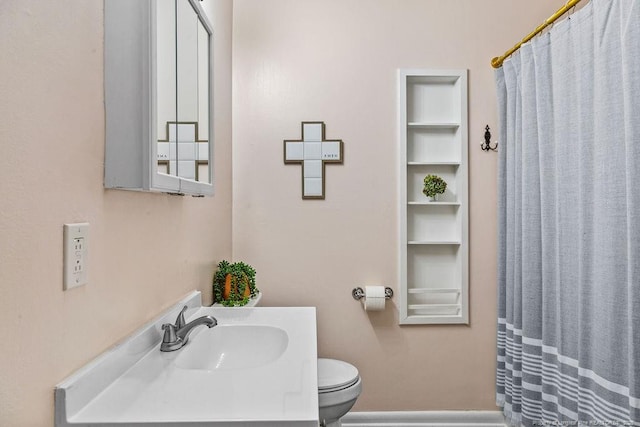 6407 Kimridge Rd, Fayetteville, NC 28314 - bathroom with curtained shower, toilet, and vanity