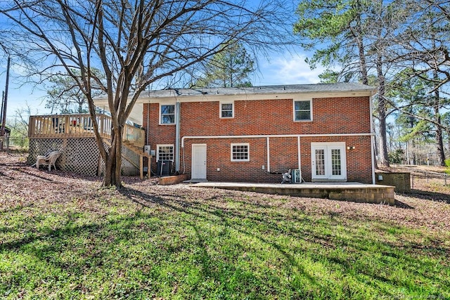 6407 Kimridge Rd, Fayetteville, NC 28314 - back of property featuring brick siding, a lawn, french doors, and a wooden deck