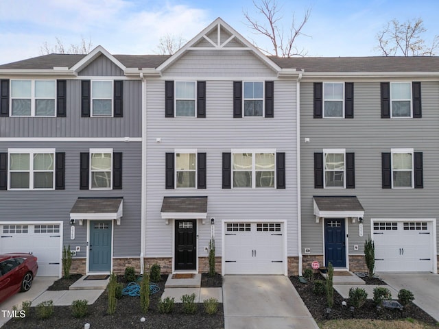 1558 Indigo Creek Dr, Zebulon, NC 27597 - multi unit property featuring concrete driveway, a garage, and stone siding