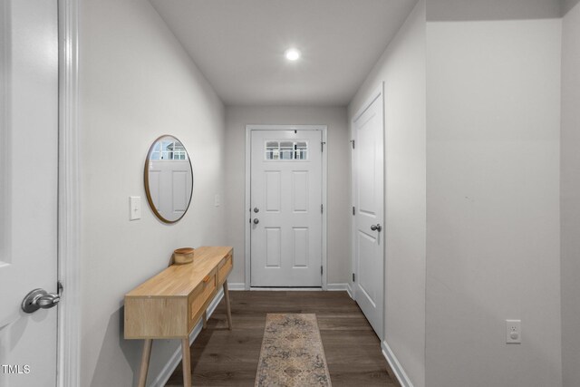 1558 Indigo Creek Dr, Zebulon, NC 27597 - doorway featuring baseboards and dark wood finished floors