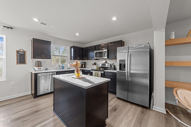 1558 Indigo Creek Dr, Zebulon, NC 27597 - kitchen featuring visible vents, light wood-style flooring, appliances with stainless steel finishes, and light countertops