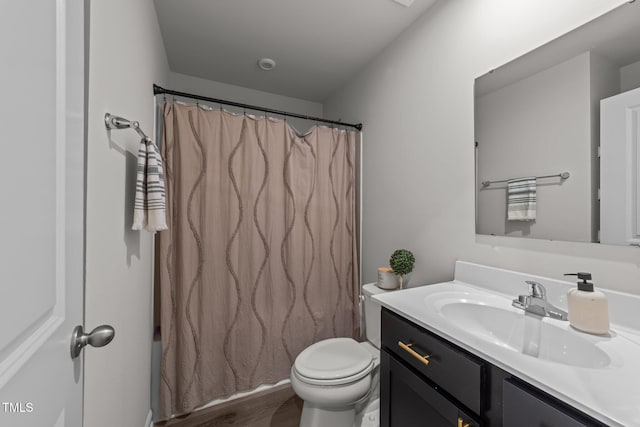 1558 Indigo Creek Dr, Zebulon, NC 27597 - full bath featuring a shower with shower curtain, toilet, wood finished floors, and vanity