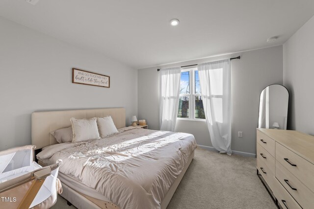 1558 Indigo Creek Dr, Zebulon, NC 27597 - bedroom featuring baseboards and light carpet