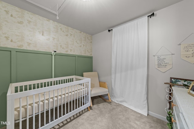 1558 Indigo Creek Dr, Zebulon, NC 27597 - carpeted bedroom with wallpapered walls, attic access, a nursery area, wainscoting, and a decorative wall