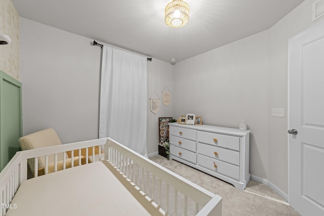 1558 Indigo Creek Dr, Zebulon, NC 27597 - bedroom featuring baseboards, a nursery area, and carpet floors