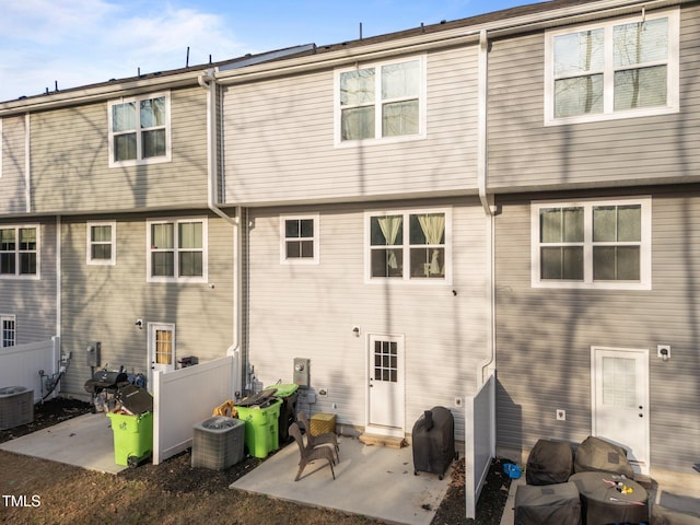 1558 Indigo Creek Dr, Zebulon, NC 27597 - back of house with cooling unit, a patio, and fence
