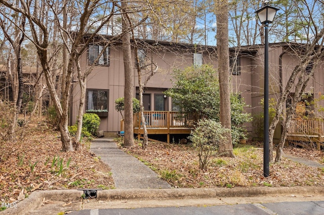 view of property with a wooden deck