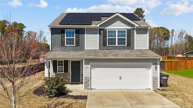 524 Mineral Spring Ln, Fuquay Varina, NC 27526 - traditional home featuring fence, driveway, an attached garage, and stone siding