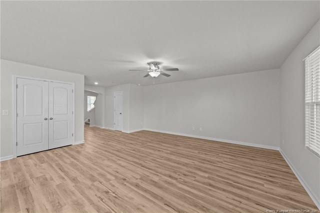 524 Mineral Spring Ln, Fuquay Varina, NC 27526 - spare room featuring baseboards, light wood-type flooring, and a ceiling fan
