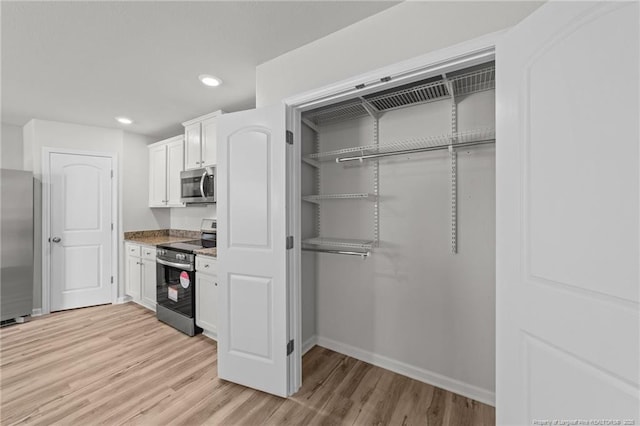 524 Mineral Spring Ln, Fuquay Varina, NC 27526 - kitchen featuring light wood-style flooring, recessed lighting, stainless steel appliances, baseboards, and white cabinets