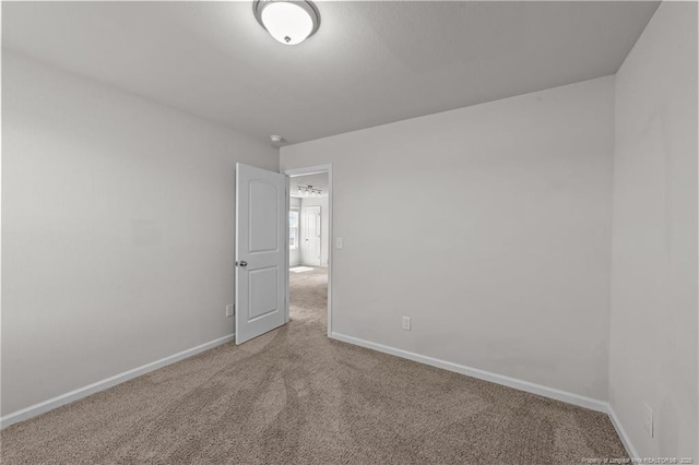 524 Mineral Spring Ln, Fuquay Varina, NC 27526 - carpeted spare room featuring baseboards