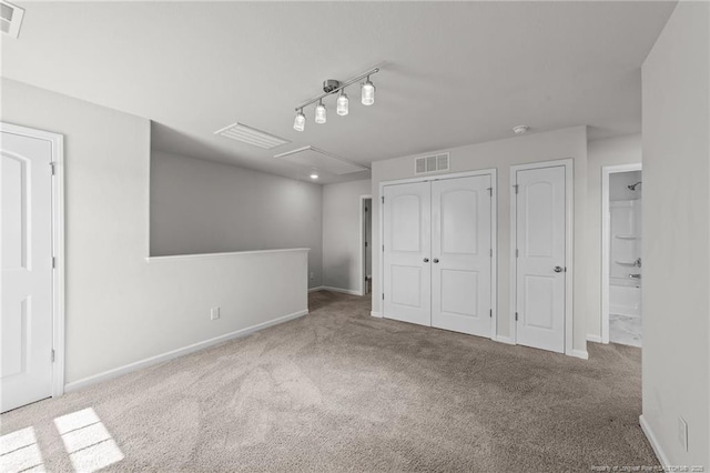 524 Mineral Spring Ln, Fuquay Varina, NC 27526 - unfurnished bedroom with carpet flooring, a closet, baseboards, and visible vents
