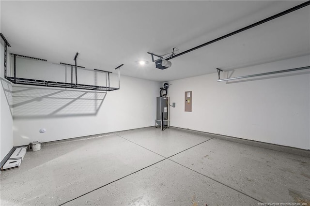 524 Mineral Spring Ln, Fuquay Varina, NC 27526 - garage featuring water heater, electric panel, and a garage door opener
