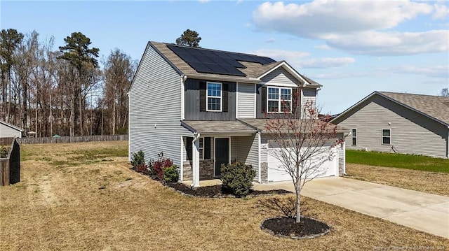 524 Mineral Spring Ln, Fuquay Varina, NC 27526 - traditional-style house with driveway, a front yard, fence, roof mounted solar panels, and a garage