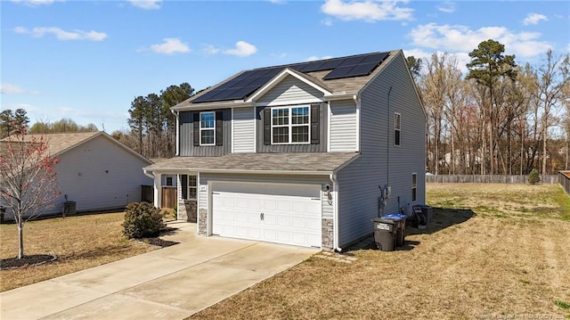 524 Mineral Spring Ln, Fuquay Varina, NC 27526 - traditional home with stone siding, fence, roof mounted solar panels, a garage, and concrete driveway