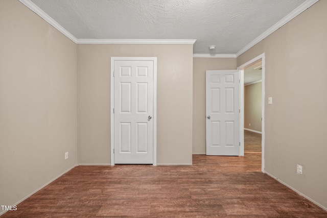 234 Rolling Hills Rd, Skipwith, VA 23968 - unfurnished bedroom featuring crown molding, wood finished floors, baseboards, and a textured ceiling