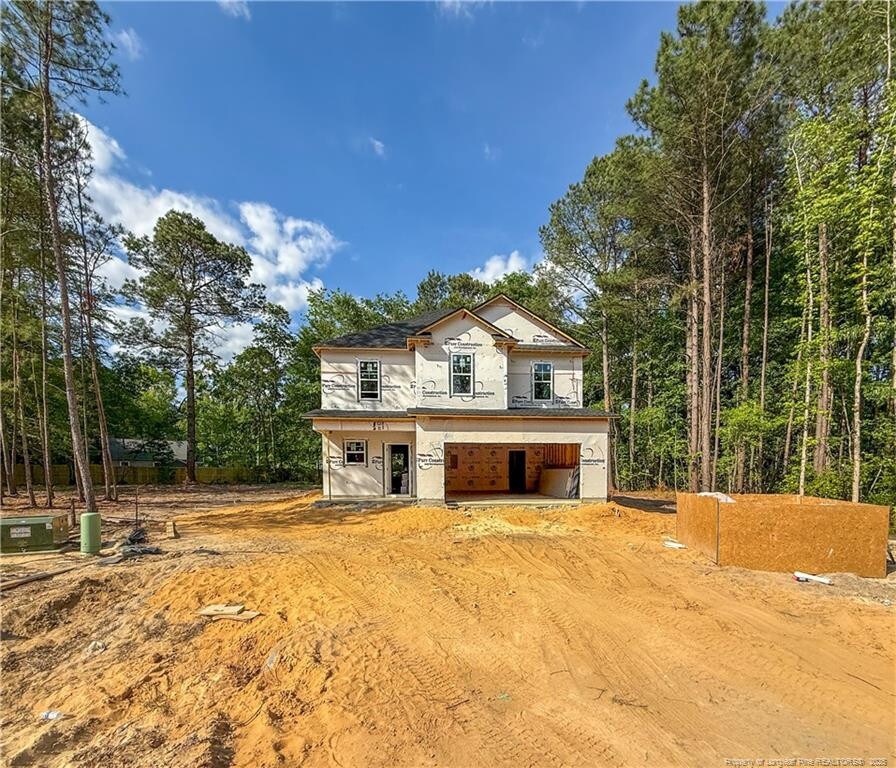 3839 Hatteras Ct, Fayetteville, NC 28312 - view of home's exterior featuring dirt driveway and an attached garage